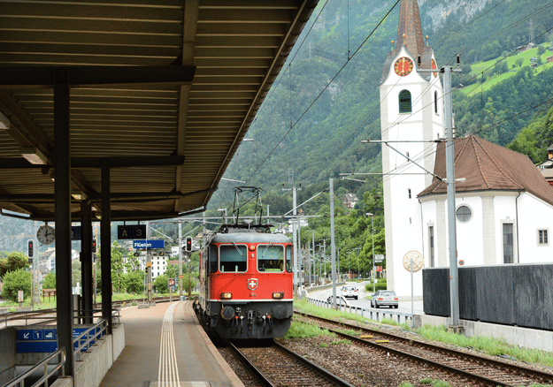 Railway station platform canopy on steel columns beside the track